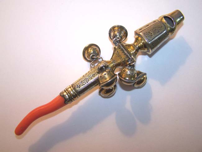An early 19th century English Silver-Gilt Baby Rattle with Bells, Whistle and Coral Stem